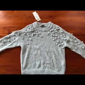 Pretty blue Norwegian sweater with pom-poms